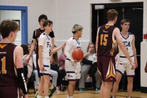 Fredericton Christian Academy students participating in game basketball, promoting sports and teamwork.